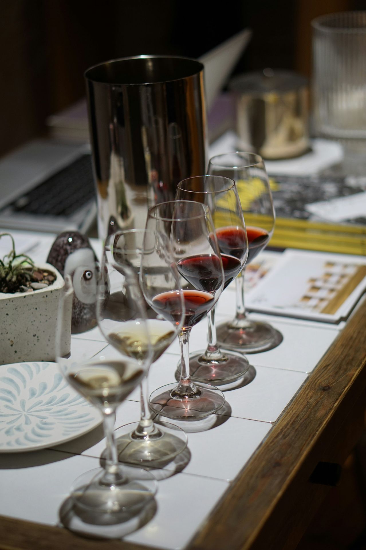 a group of wine glasses on a table